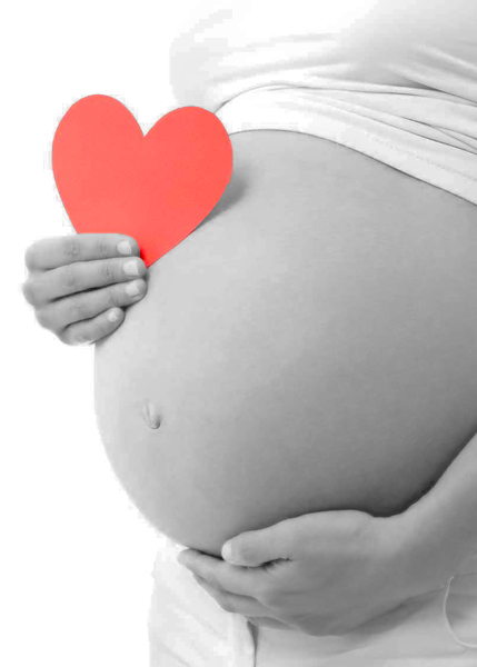 Pregnant's woman belly with heart